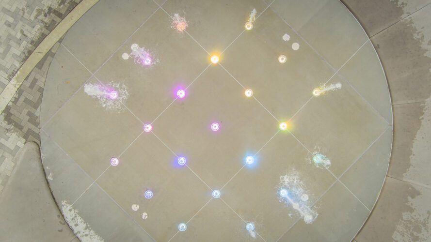 Overhead view of fountain with different lights.