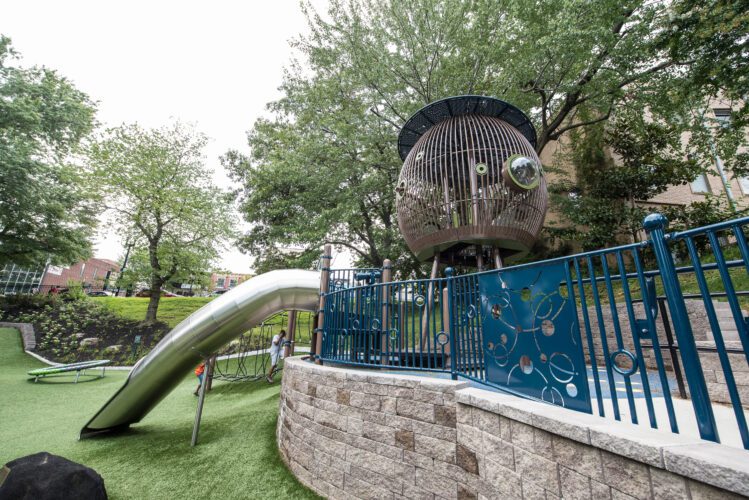 View of large climbing structure and slide.