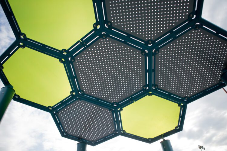 Shade structure made of several hexagon shapes.