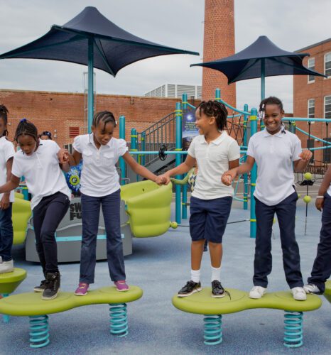Several kids on balance beams.