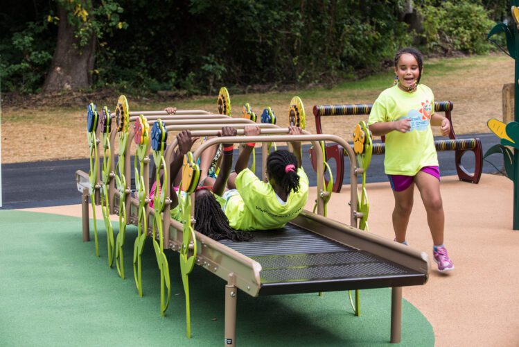 Kids playing on roller slide.