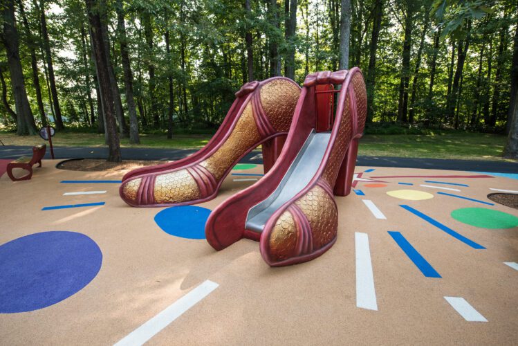 Slides in shape of Dorothy's red slippers.