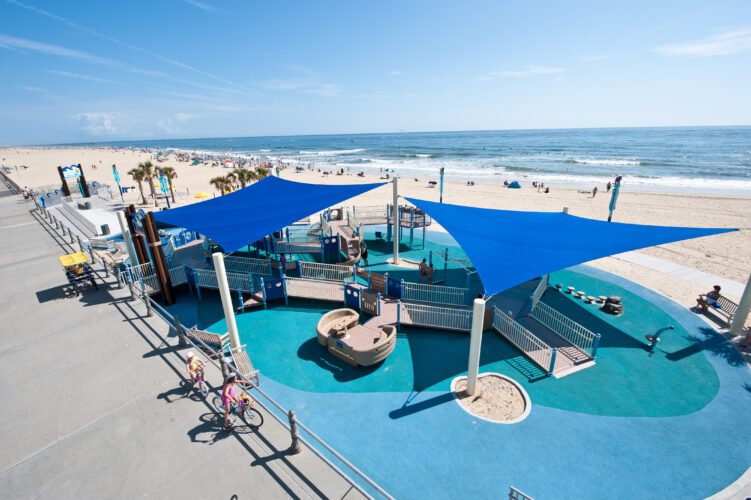 Playground with large blue shade structure over the top.