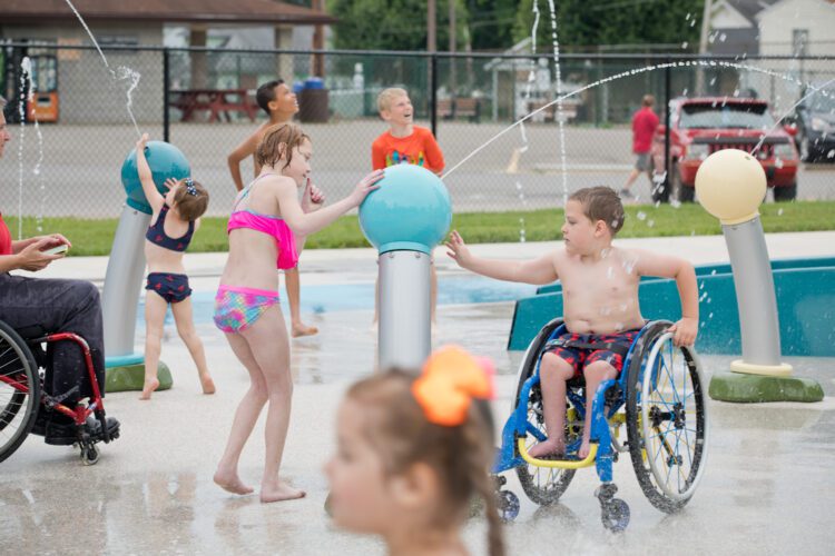 Kids playing in splash pad.