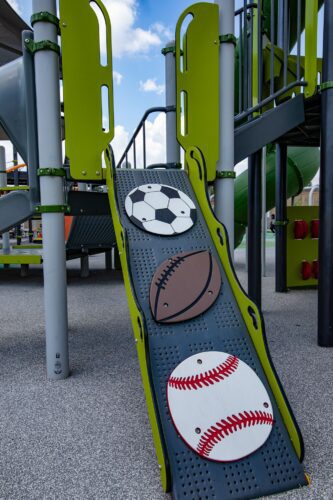 Custom sports-themed climbing equipment at the Fields at RFK playground in Washington, DC, installed by Sparks at Play using LSI equipment.