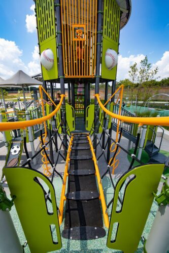 First-person point-of-view looking down a bridge walkway at the Fields at RFK playground in Washington, DC, installed by Sparks at Play using LSI equipment.