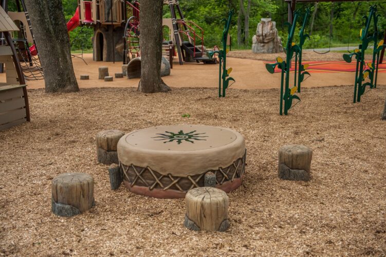 Custom gathering spot for children and families at the Indian Creek Playground in Berwyn Heights, MD, designed for imaginative and social play, installed by Sparks at Play using LSI equipment.