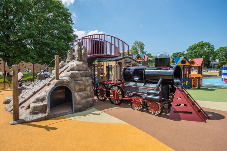 Overview of custom train and GFRC mountain on 5-12 playground structure at Turkey Thicket Recreation Center Washington DC