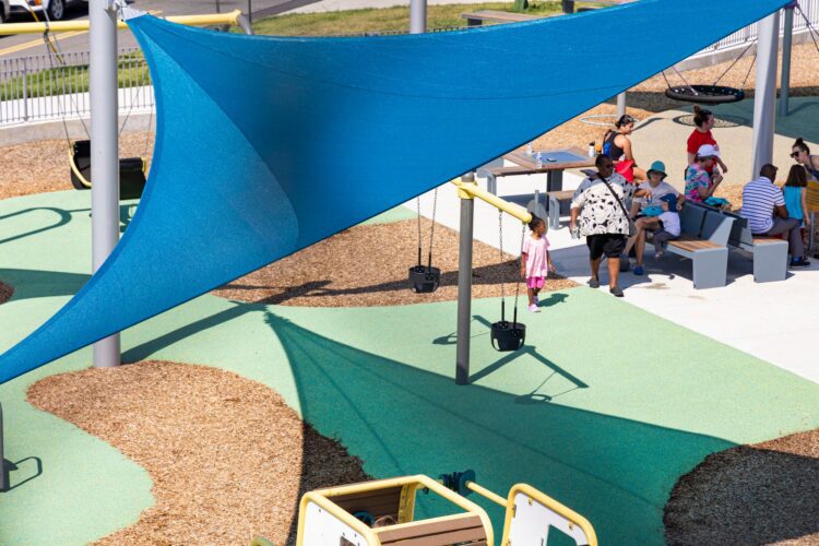 LSI SkyWays® shade structures over the Jennie Dean Park playground in Arlington, VA, providing sun protection for children and families, installed by Sparks at Play.