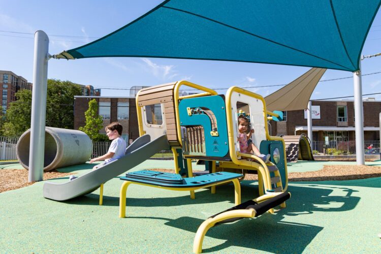 LSI SkyWays® shade structure above the Smart Play® Cube at the Jennie Dean Park playground in Arlington, VA, installed by Sparks at Play.