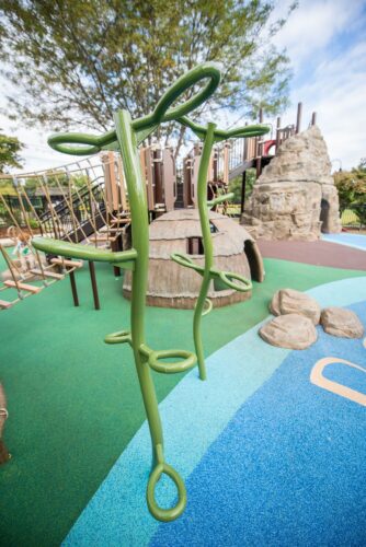 Custom Plant-themed metal climber at the Palisades Recreation Center playground in Washington, DC, installed by Sparks at Play using LSI equipment.