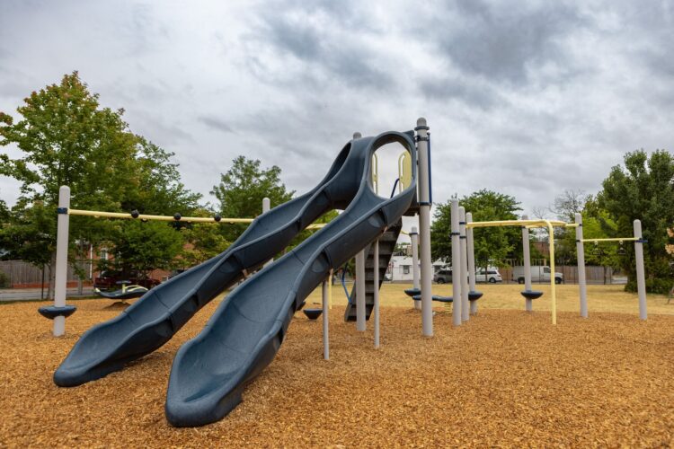 Landscape Structures Gemini SlideWinder2 slide at Franklin Square Elementary playground Baltimore MD