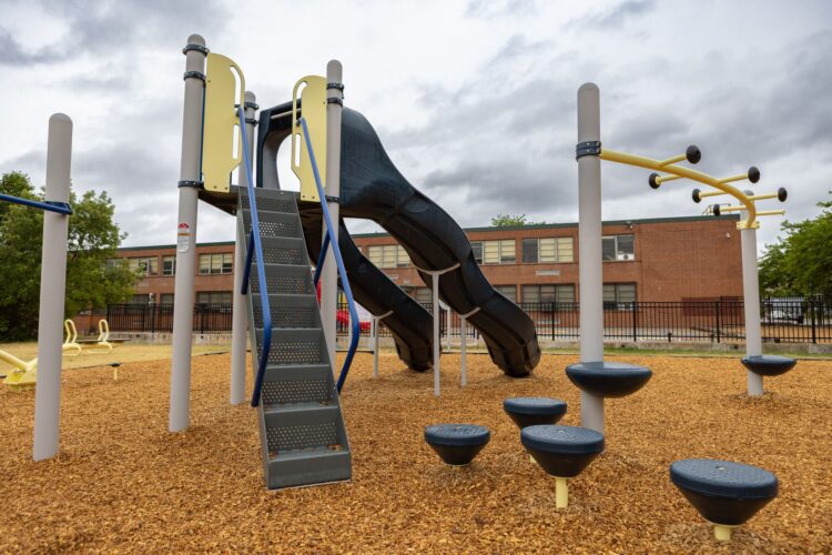 Playground stairs and Gemini SlideWinder2 slide at Franklin Square Elementary playground Baltimore MD Landscape Structures