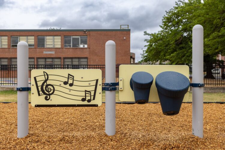 Music note learning panels and bongo reach panels at Franklin Square Elementary playground Baltimore MD Landscape Structures