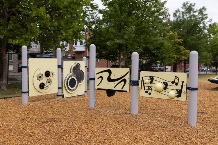 Overview of learning panels at Franklin Square Elementary playground Baltimore MD Landscape Structures