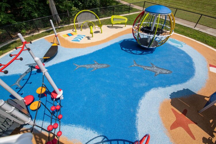 Surface America poured-in-place rubber surfacing with ocean and beach graphics at J. Franklyn Bourne Park
