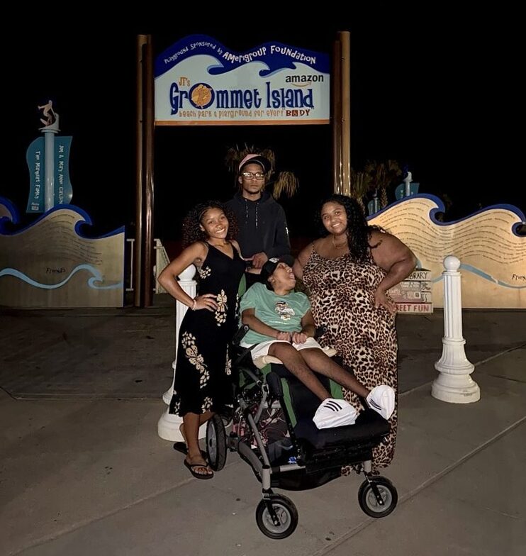 Adiana, Alani, AJ, and Ahmahry enjoying a visit together as adults at the Grommet Island Beach Park inclusive playground in Virginia Beach.